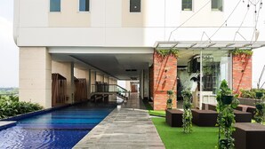 Outdoor pool - Cozy And Well Furnished Studio Apartment At B Residence (Pagedangan)