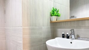 Studio | Bathroom - Best Homey And Nice Studio At Vasanta Innopark Apartment (Cikarang)