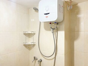 Studio | Bathroom | Shower, towels, soap, shampoo - Good Choice And Comfy Studio At Springlake Summarecon Bekasi Apartment (Bekasi)