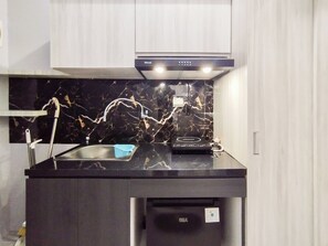 Studio | Private kitchen | Mini-fridge, stovetop - Modern Studio Room Apartment At Grand Asia Afrika (Bandung)