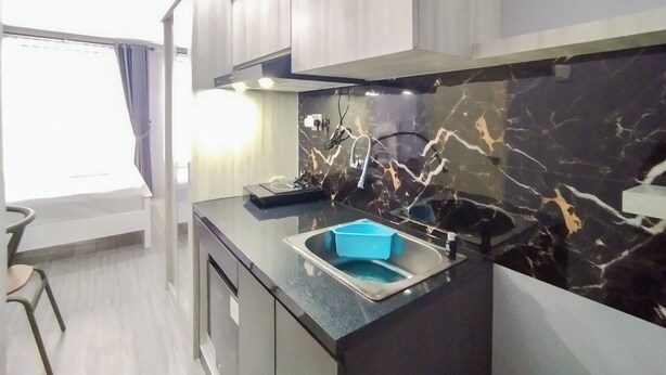 Unclassified image, 1 of 21, button - Homey Grey Studio Apartment at Grand Asia Afrika Bandung By Travelio (Bandung)