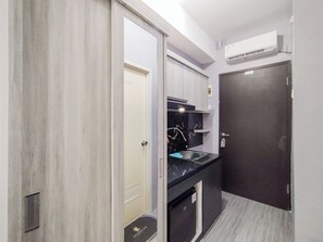 Interior - Homey Grey Studio Apartment at Grand Asia Afrika Bandung By Travelio (Bandung)