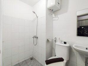 Studio | Bathroom | Shower, towels, soap, shampoo - Homey Grey Studio Apartment at Grand Asia Afrika Bandung By Travelio (Bandung)
