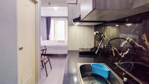 Unclassified image, 4 of 21, button - Homey Grey Studio Apartment at Grand Asia Afrika Bandung By Travelio (Bandung)