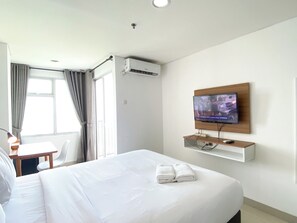 Studio | Free WiFi - Warm And Comfy Studio At Enviro Apartment (Cikarang)
