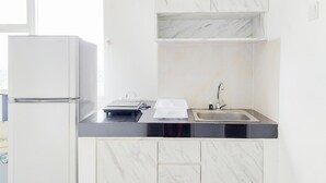 Apartment | Private kitchen | Fridge, stovetop, rice cooker - Fully Furnished With Cozy Designed 2Br Serpong Garden Apartment (Cisauk)
