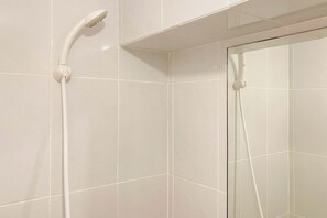 Studio | Bathroom | Shower, towels, soap, shampoo - Cozy Studio Apartment Tokyo Riverside Pik 2 (Teluknaga)