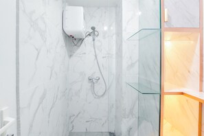 Studio | Bathroom | Shower, towels, soap, shampoo - Best Deal And Comfy Studio Apartment Anwa Residence (South Tangerang)
