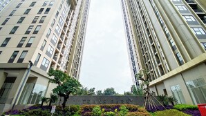 A high-rise building with a sign reading "TRANS PARK". - Well Designed And Comfy Studio Transpark Cibubur Apartment (Bekasi)