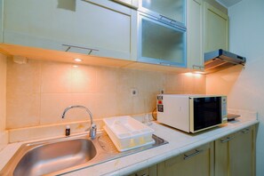 Apartment | Private kitchen | Full-size fridge, stovetop - Modern Look And Comfy 3Br Apartment Bellagio Residence (Jakarta)