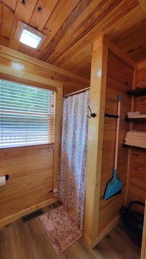 Shower, hair dryer, towels, soap - Cozy Cove. A cozy one bedroom tiny home.  (Lucas)