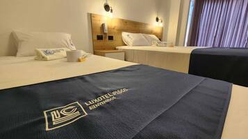 Premium bedding, down duvets, memory-foam beds, laptop workspace