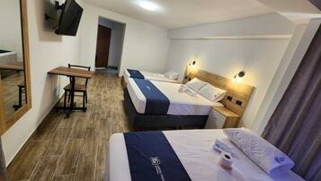 Comfort Triple Room | Premium bedding, down duvets, memory-foam beds, laptop workspace