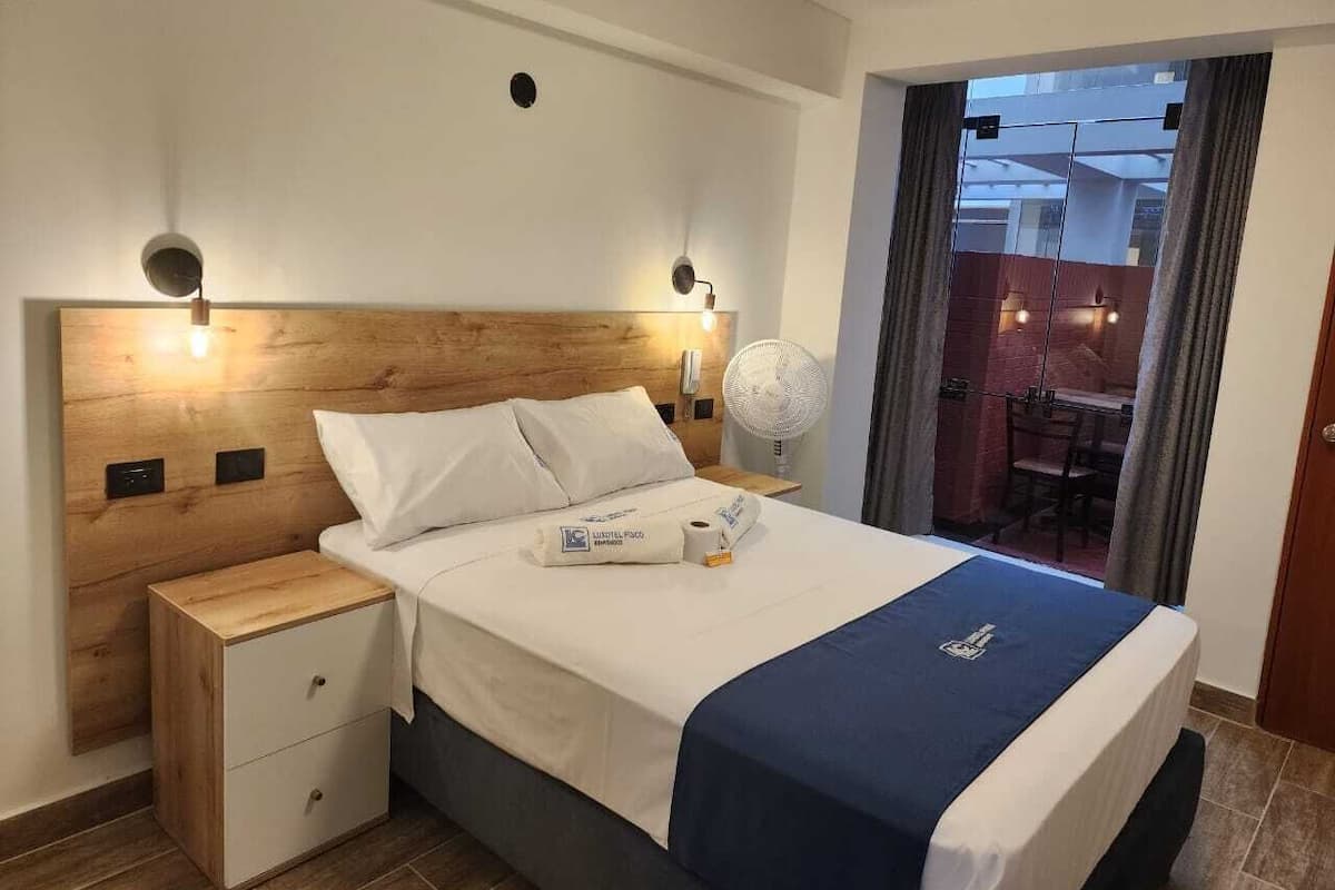 Premium bedding, down duvets, memory-foam beds, laptop workspace