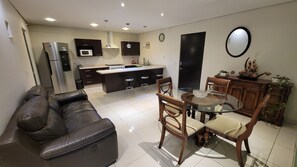 Deluxe Apartment | Living area | 10-inch Smart TV with digital channels, streaming services