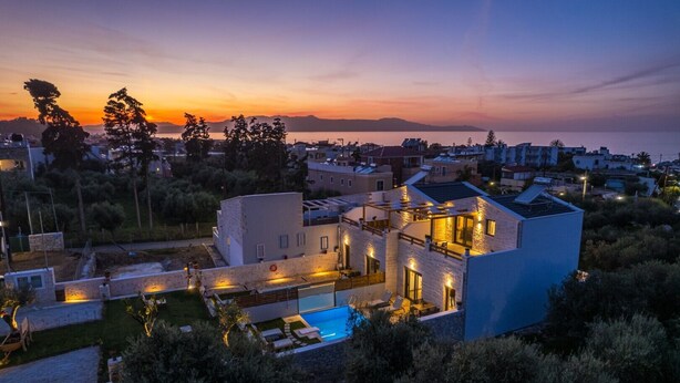 A modern villa with a swimming pool, surrounded by lush greenery and overlooking a coastal area. - 2steps Agia Marina Beach/new Built/no Car Needed/tavernas & Supermarket at 50mt (Agia Marina)