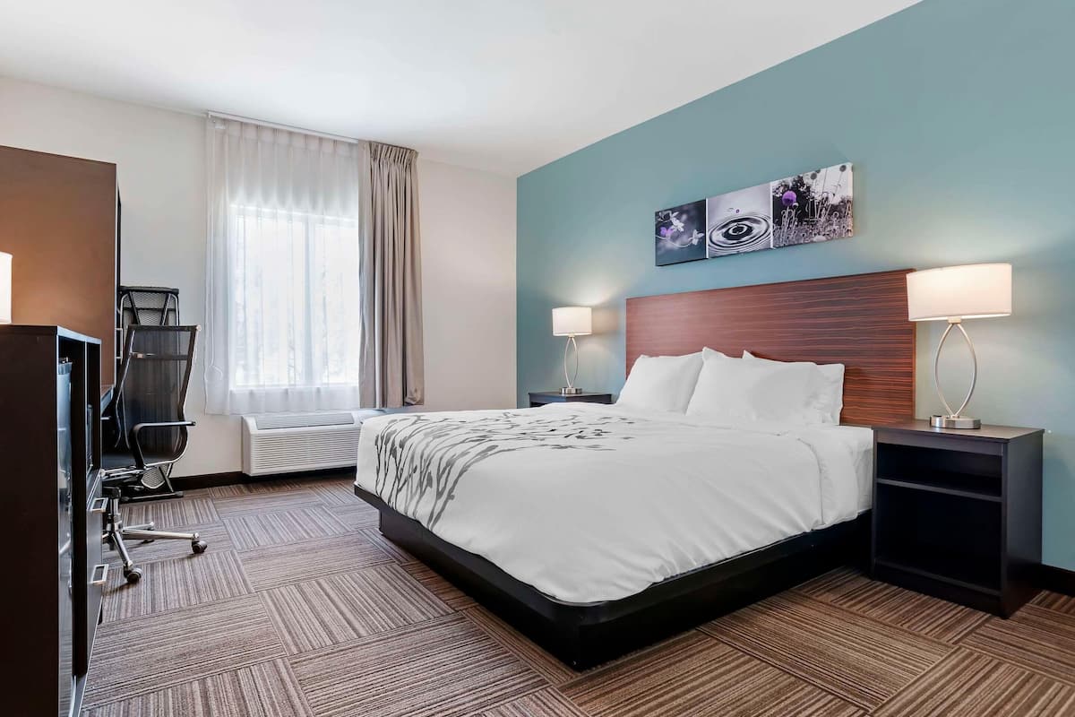 Premium bedding, desk, laptop workspace, blackout curtains