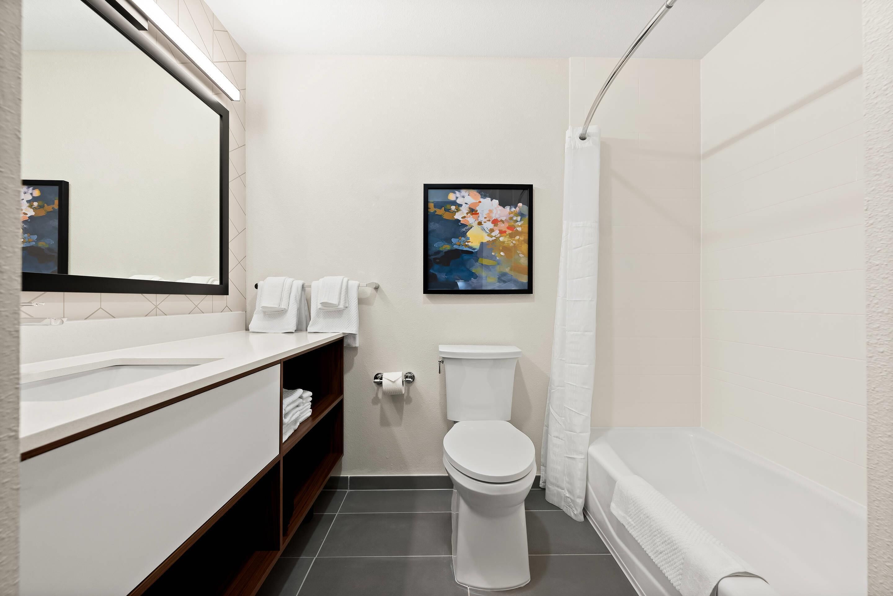 Basic Suite, 2 Queen Beds, Non Smoking | Bathroom | Combined shower/tub, hydromassage showerhead, hair dryer, towels