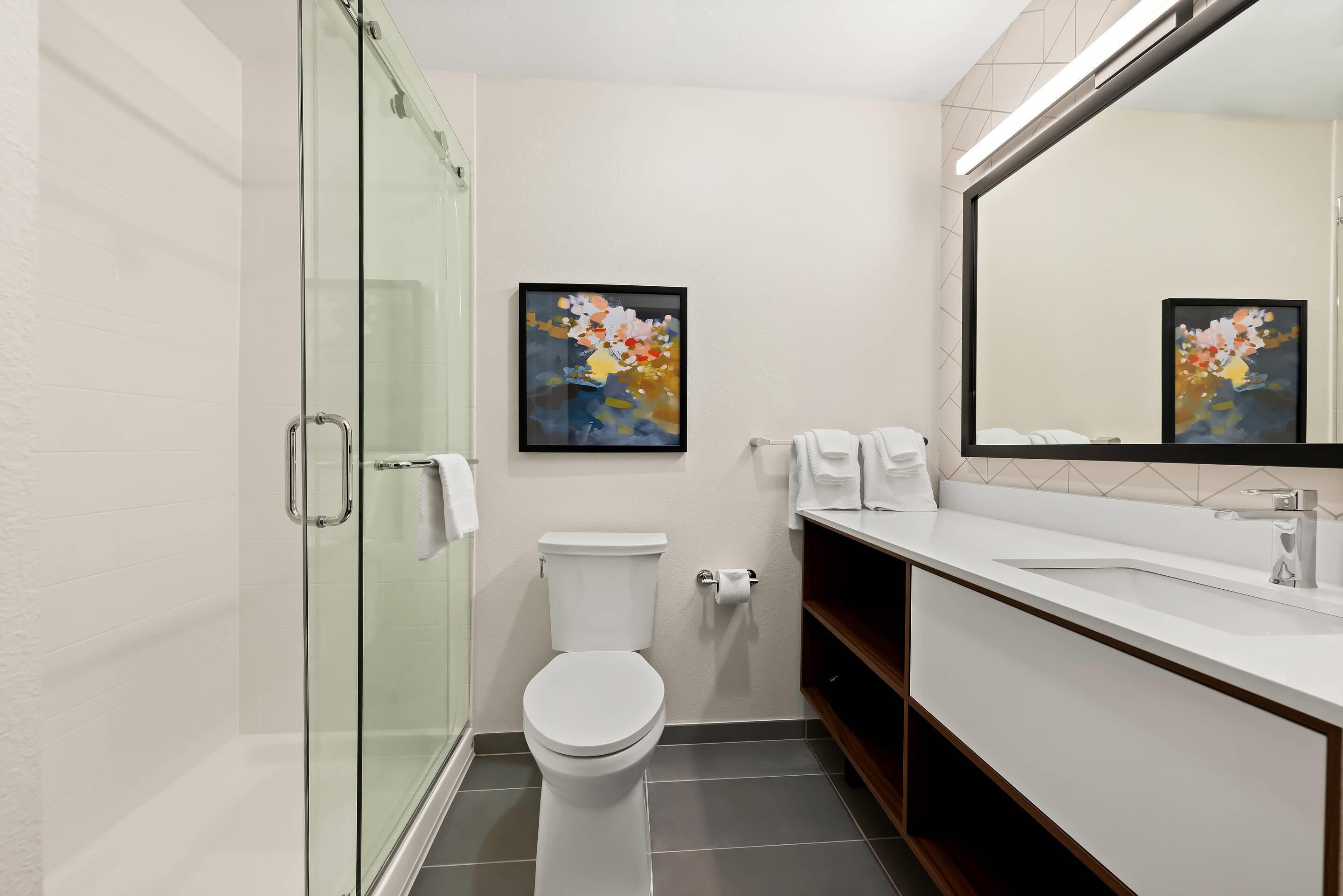 Suite, 1 King Bed, Non Smoking | Bathroom | Combined shower/bathtub, hydromassage showerhead, hair dryer, towels