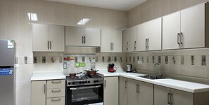 Design Apartment, 2 Bedrooms | Private kitchen | Electric kettle - Al-Mutamarat A-15 Timeless History GZ10 (Riyadh)