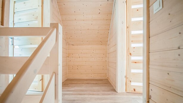 A narrow wooden hallway with a sloped ceiling and a wooden floor. - Gorgeous home in Sarbinowo with WiFi (Sarbinowo)