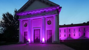 A building with a classical architectural style, featuring a central entrance with columns and a pediment. - Ferienwohnung Rheinsberg (Rheinsberg)