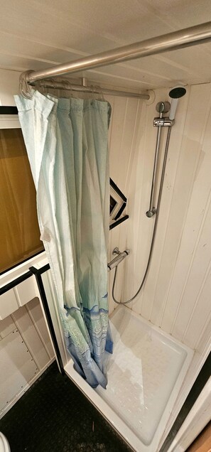 Shower, towels, soap, toilet paper