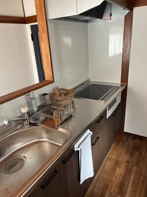 Fridge, microwave, stovetop, cookware/dishes/utensils