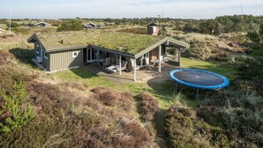 A house with a patio area, a trampoline, and a small shed. - "Neja" - 400m from the sea by Interhome (Blåvand)