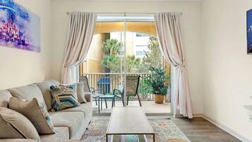 Condo, Multiple Beds, Balcony, Garden View (Playful Paradise At Windsor Hills) | Living area | 42-inch flat-screen TV with digital channels