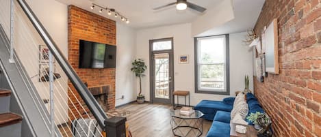 House, Multiple Beds, Balcony, City View | Living area | TV, fireplace