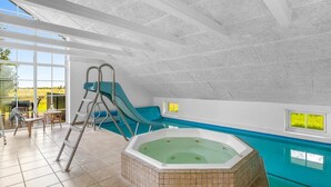 An indoor swimming pool with a hot tub, slides, and a view of the outdoors. - "Joseline" - 1.8km from the sea by Interhome (Blåvand)
