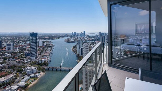 A high-rise building with a view of a river and cityscape. - Circle on Cavill Sky Home! (Gold Coast)