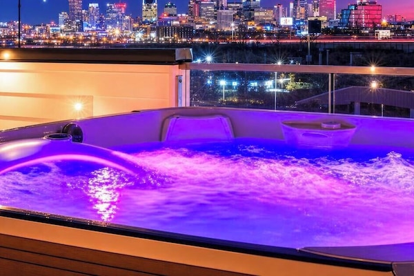 Experience Nashville nights in your private hot tub with stunning skyline views. This rooftop oasis is perfect for bachelorette parties or corporate retreats, offering a chic escape in the heart of Music City. Relax and soak in downtown's vibrant energy.
