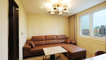 Exclusive Room | Living area | 65-inch Smart TV with cable channels