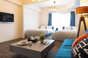 A hotel room with two beds, a coffee table with cups and a remote control, a lamp, and a TV on the wall. - Tanimachikun Star Hotel Ebisunishi 48 (Osaka)
