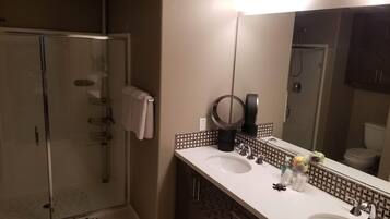 Shower, hair dryer, towels, soap