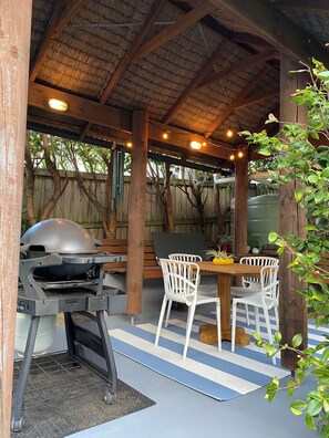 Outdoor dining - Beachside cabin + solar heated pool @ Spoon Bay (Forresters Beach)