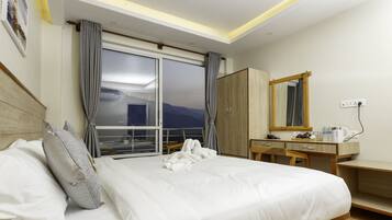 Premium bedding, desk, laptop workspace, soundproofing