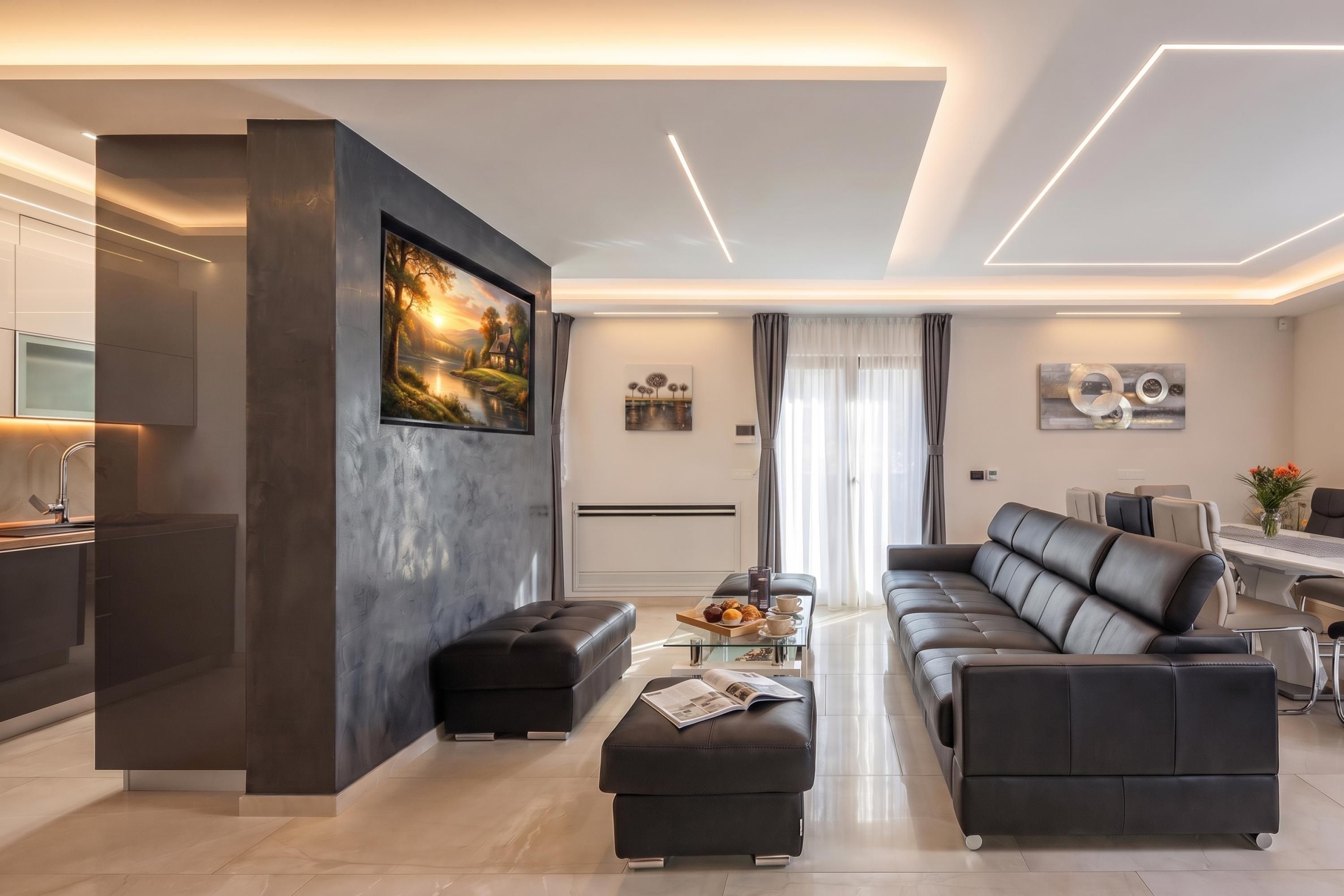 A modern living room with a sofa, ottoman, and a coffee table with a magazine.