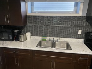 Fridge, microwave, oven, stovetop - Cozy Get-Away Suite (Regina)