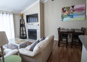 Signature Condo, 1 Bedroom, Balcony | Living area | 55-inch Smart TV with digital channels, fireplace - Cove View 206 - Minutes to Beach (Galveston)