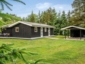 A two-story building with a covered patio area, a small deck, and a garage. - "Atla" - 2.5km from the sea by Interhome (Blåvand)