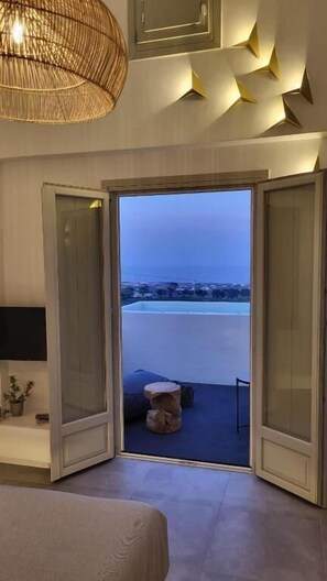 Junior Suite, Hot Tub, Sea View | Living area | 42-inch flat-screen TV with digital channels, TV