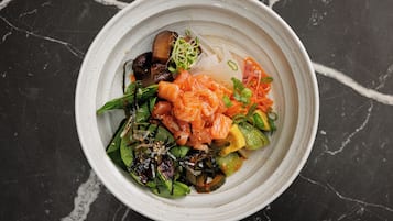 A bowl of food with various ingredients.
