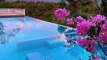 Outdoor pool, pool umbrellas, sun loungers