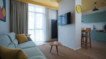 Luxury Suite | Living area | 55-inch Smart TV with digital channels, Netflix, streaming services
