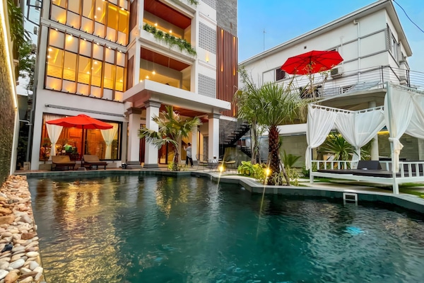 Outdoor pool, open 9:00 AM to 10:00 PM, free cabanas, pool umbrellas