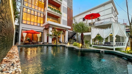 Outdoor pool, open 9:00 AM to 10:00 PM, free cabanas, pool umbrellas