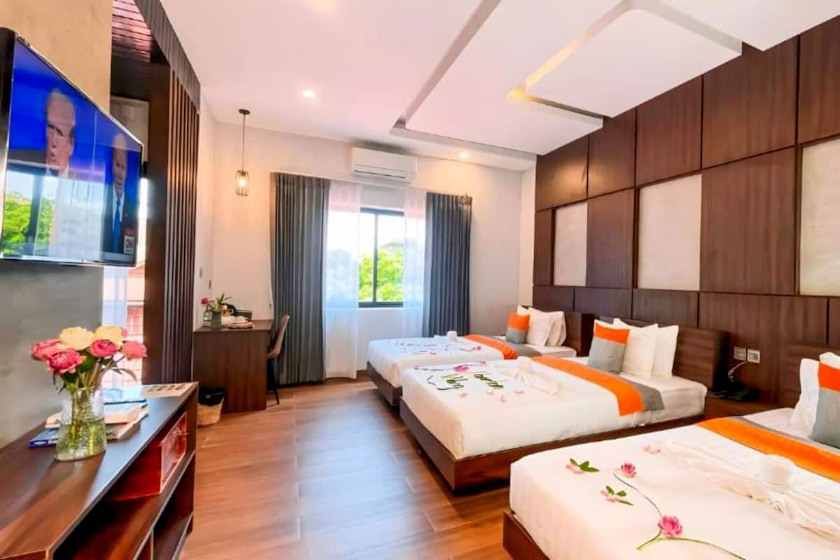 Triple Room with Balcony (Free Bus Station Pick Up) | Minibar, in-room safe, desk, laptop workspace